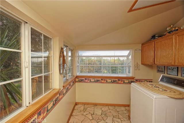 laundry area with washer / clothes dryer and cabinets