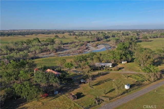 drone / aerial view featuring a rural view and a water view