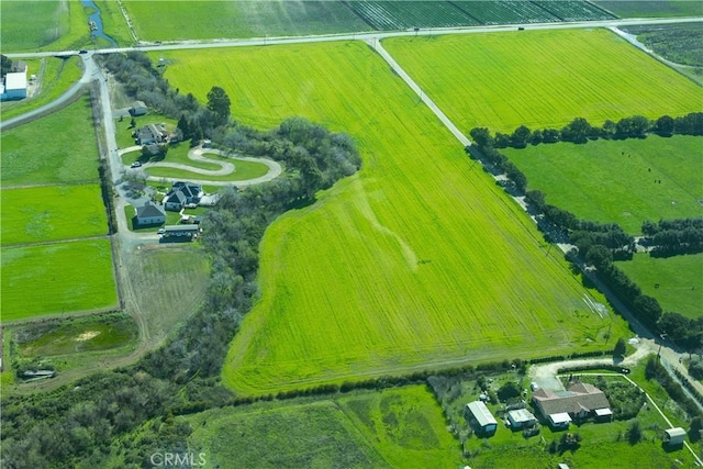 birds eye view of property with a rural view