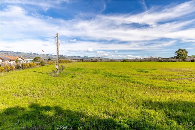 view of yard with a rural view