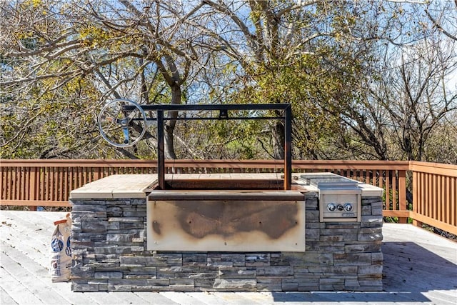 view of patio featuring area for grilling and a wooden deck