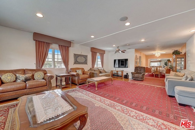 living room with ceiling fan and wood-type flooring