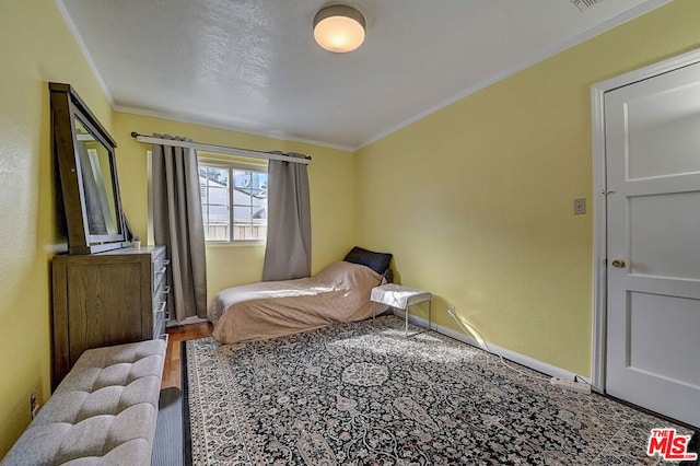 bedroom featuring ornamental molding