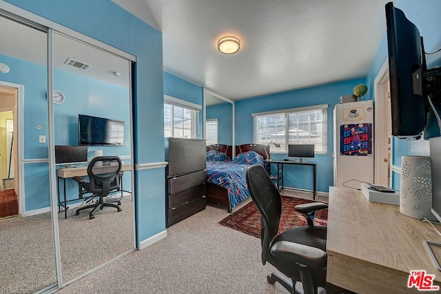 bedroom with light carpet