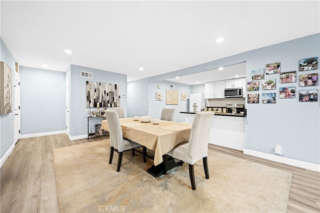 dining area featuring light hardwood / wood-style flooring