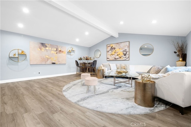 living room featuring hardwood / wood-style flooring and vaulted ceiling with beams