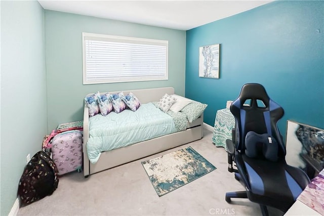 bedroom featuring light colored carpet