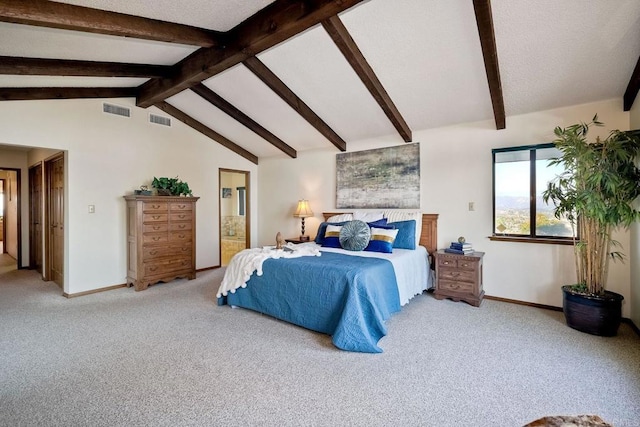 carpeted bedroom featuring connected bathroom and vaulted ceiling with beams