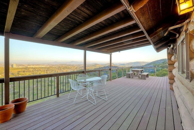 wooden terrace featuring a mountain view