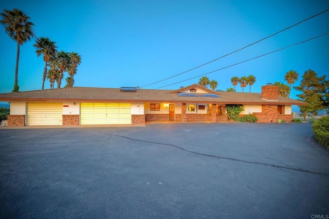 single story home with a garage