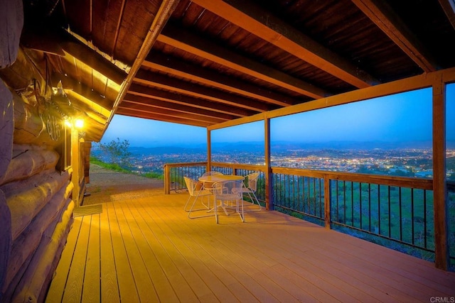 deck at dusk with a mountain view