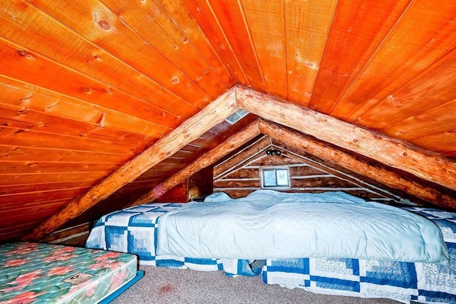 unfurnished bedroom with lofted ceiling, wooden walls, wood ceiling, and carpet flooring