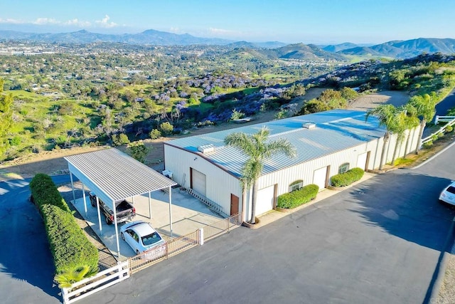 drone / aerial view featuring a mountain view