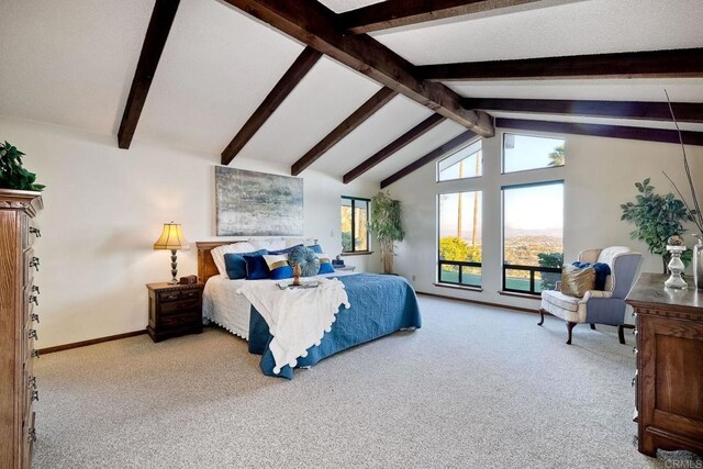 carpeted bedroom featuring lofted ceiling with beams