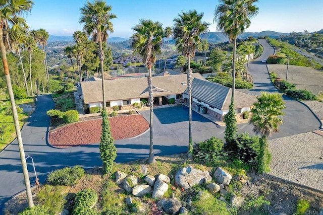 birds eye view of property with a mountain view