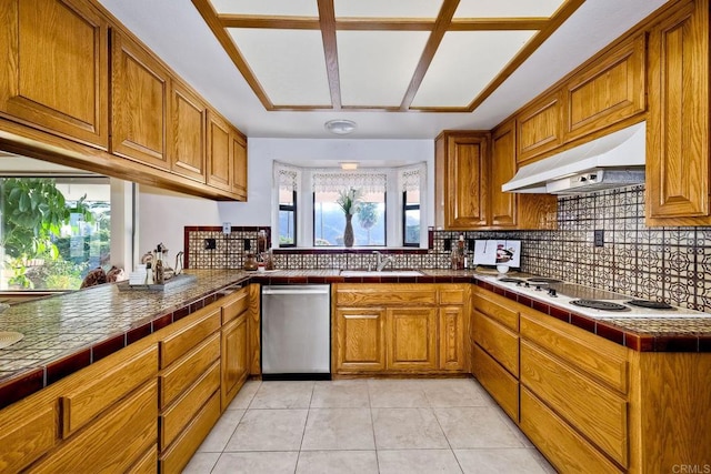 kitchen featuring tile countertops, stainless steel dishwasher, sink, and white stovetop