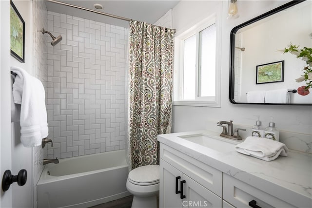 full bathroom featuring toilet, shower / bath combo, and vanity