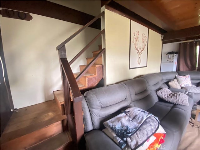 living room with wood ceiling, hardwood / wood-style floors, and beamed ceiling