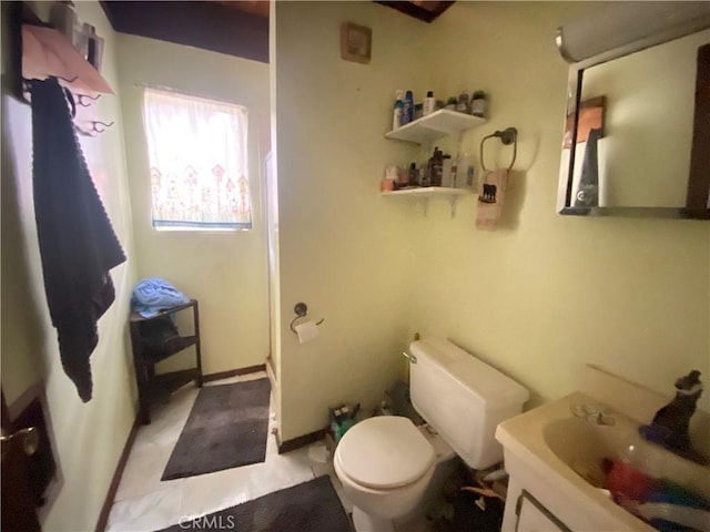 bathroom with a shower with door, toilet, and vanity