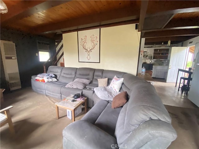 living room with concrete flooring and wood ceiling