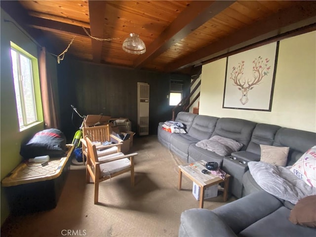 carpeted living room with beam ceiling and wood ceiling