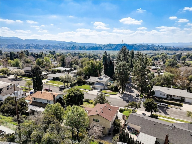 birds eye view of property with a mountain view