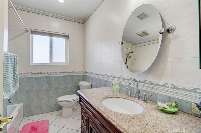 full bathroom featuring vanity, shower / washtub combination, tile walls, tile patterned flooring, and toilet