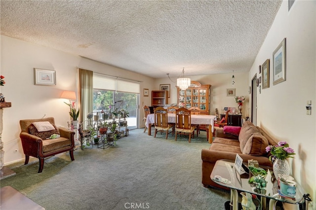 living room featuring a textured ceiling, carpet floors, and a notable chandelier