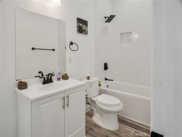 full bathroom with hardwood / wood-style floors, toilet, vanity, and bathing tub / shower combination