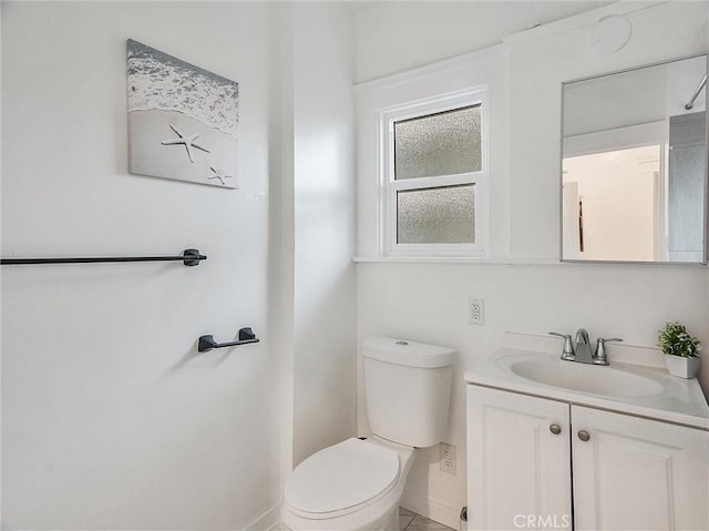 bathroom featuring toilet and vanity