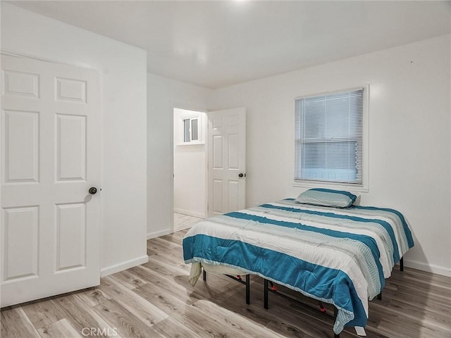 bedroom with light hardwood / wood-style flooring