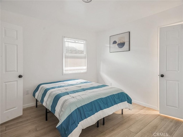 bedroom featuring light wood-type flooring