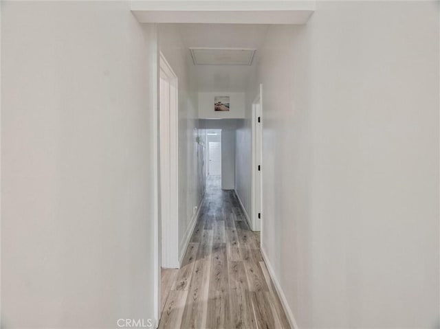 hallway with light wood-type flooring