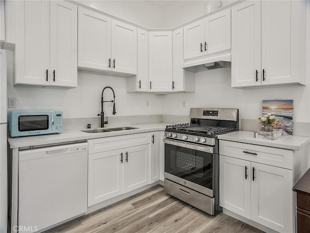 kitchen with white cabinetry, dishwasher, stainless steel range with gas stovetop, and sink