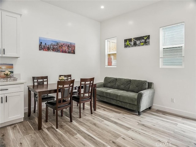 dining area with a healthy amount of sunlight and light wood-type flooring