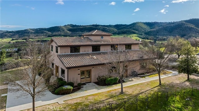 exterior space featuring a mountain view and french doors