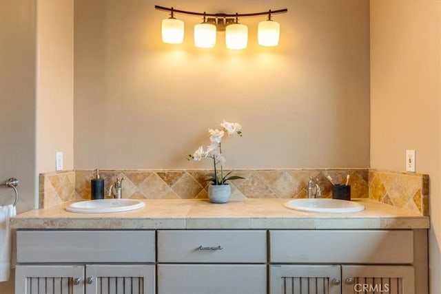 bathroom with decorative backsplash and vanity