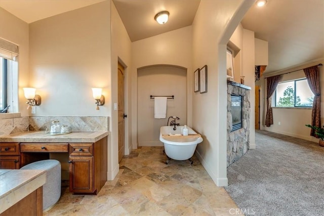bathroom with tasteful backsplash, vanity, and lofted ceiling