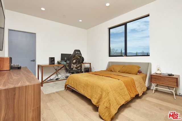 bedroom with light wood-type flooring