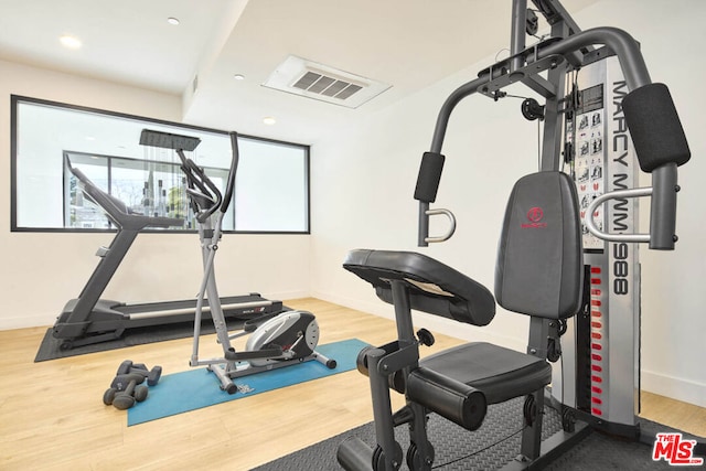 exercise area with wood-type flooring