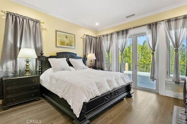 bedroom with access to exterior, crown molding, and light hardwood / wood-style floors