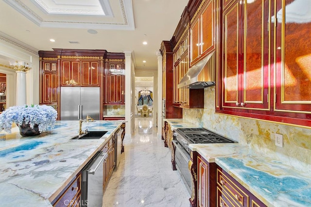 kitchen featuring high quality appliances, ornamental molding, sink, and backsplash