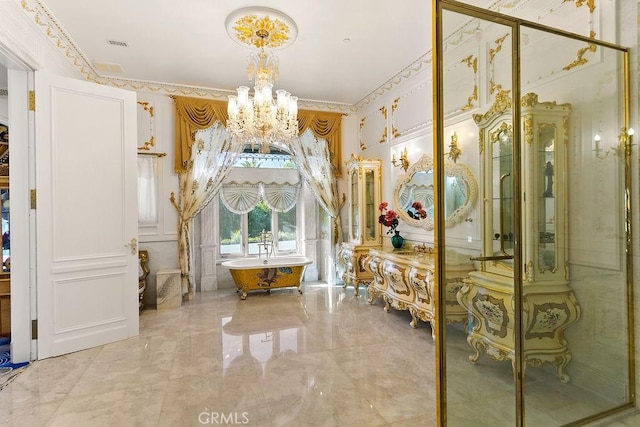 bathroom featuring a notable chandelier, ornamental molding, and a bathing tub