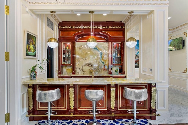 bar featuring hanging light fixtures, indoor wet bar, and visible vents