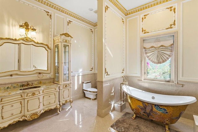 bathroom with vanity, toilet, and a bathing tub