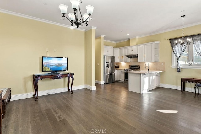 kitchen featuring an inviting chandelier, white cabinets, and appliances with stainless steel finishes