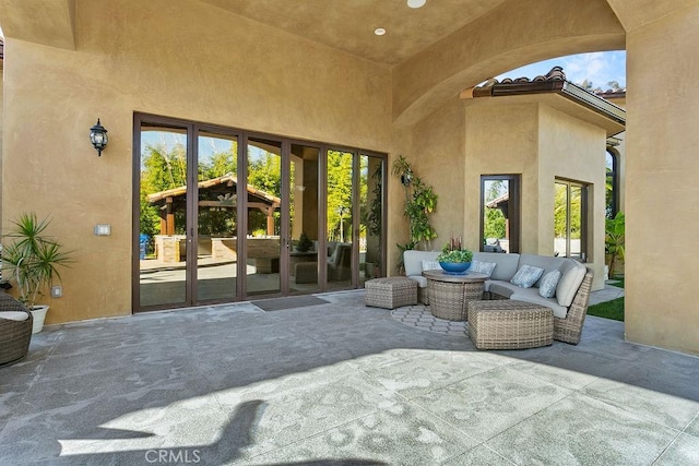 view of patio / terrace with an outdoor hangout area and french doors