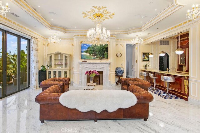 living room with a premium fireplace and ornamental molding