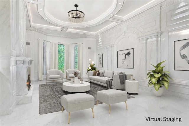 living room with ornamental molding, coffered ceiling, a notable chandelier, and a fireplace