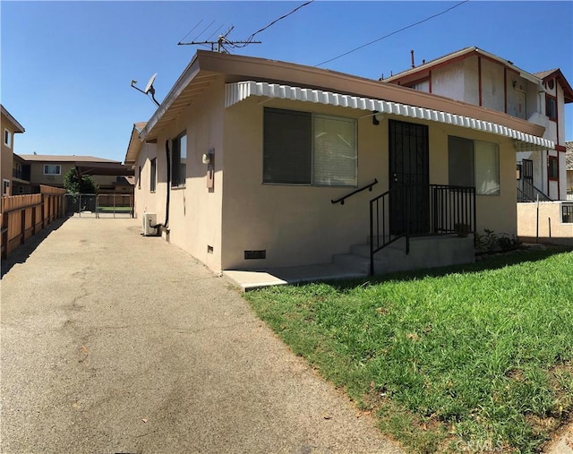 rear view of property with a yard